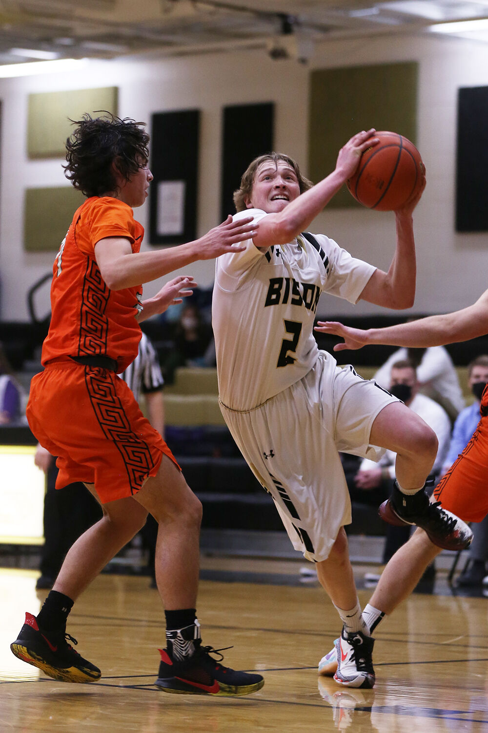 Coy Johnson pushes through two Worland defenders